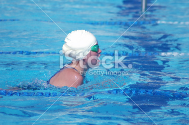 Stock Photograph of a young teenage girl swimming the breaststroke