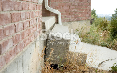 Stock photograph of the damage caused by ground  shifting under the steps