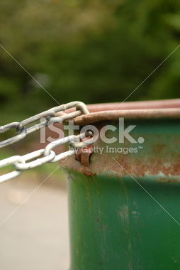 stock-photo-2162612-chained-garbage-can-portrait