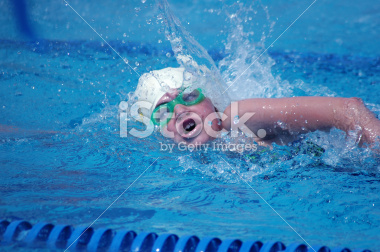 Swimmer swimming the freestyle during a swim meet