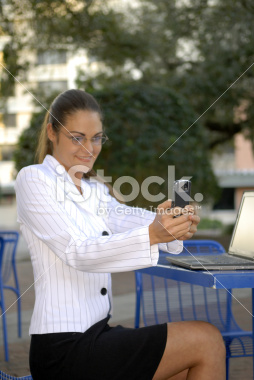 stock-photo-2853438-business-woman-with-camera-phone
