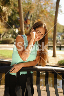 stock-photo-2864031-girl-talking-on-cell-phone-in-a-park
