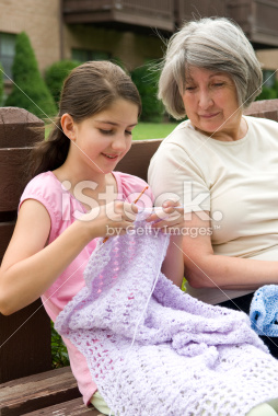 stock-photo-3719330-grandmother-teaching-her-grand-daughter-to-crochet