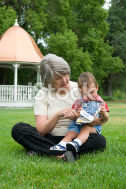 Grandmother Reading To Her Grandchildren