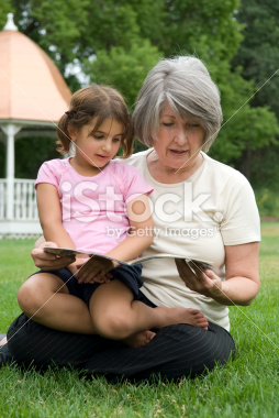 stock-photo-3719337-grandmother-reading-to-her-grand-daughter