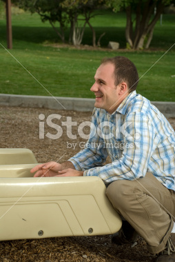 stock-photo-4542857-father-waiting-at-the-bottom-of-a-slide