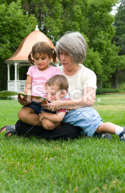 stock-photo-4643502-grandmother-reading-to-her-grandchildren