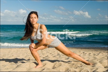 stock-photo-5645848-stretching-on-the-beach