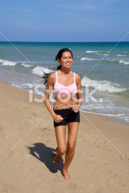 stock-photo-8891869-woman-jogging-on-the-beach